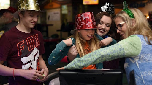 Friends celebrating at a party on the lanes