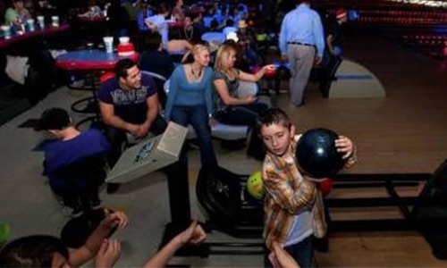 Kids and families bowling together at Yosemite Lanes