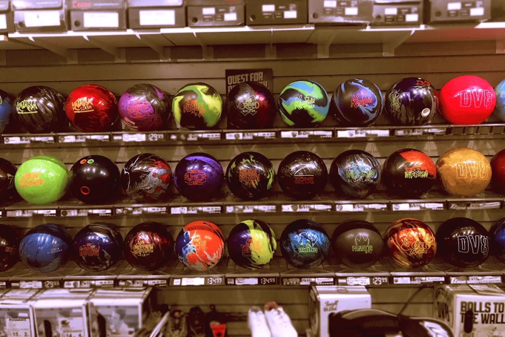 Rows of colorful bowling balls on display in the Pro Shop